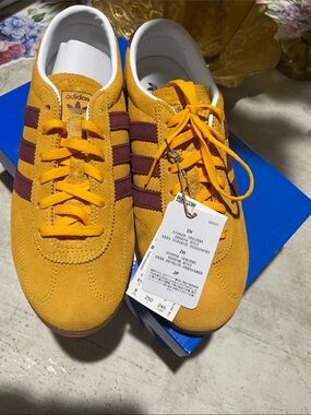 adidasSuede Sneakers in Mustard Yellow with Burgundy Stripes